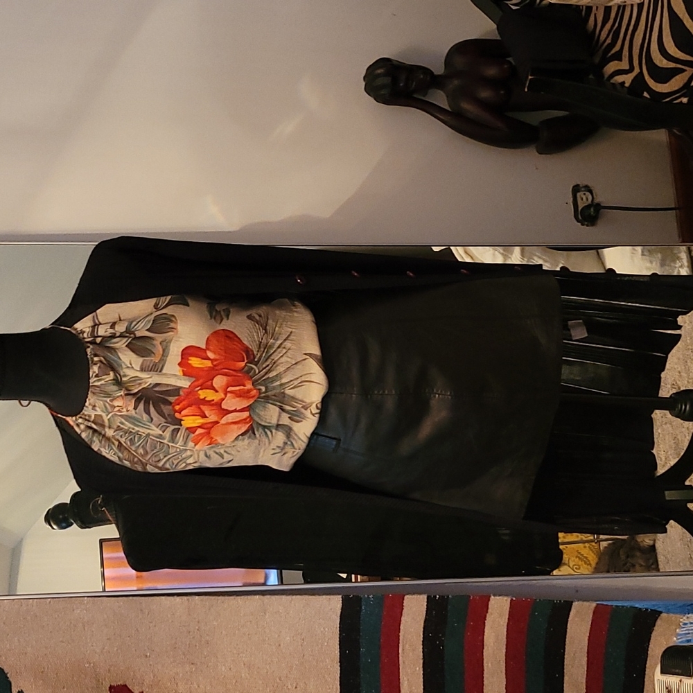 Halter, leather skirt, sweater.